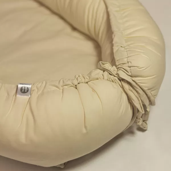 PETITE&MARS Hnízdo ochranné pro miminko FEEL SAFE 90 x 60 cm