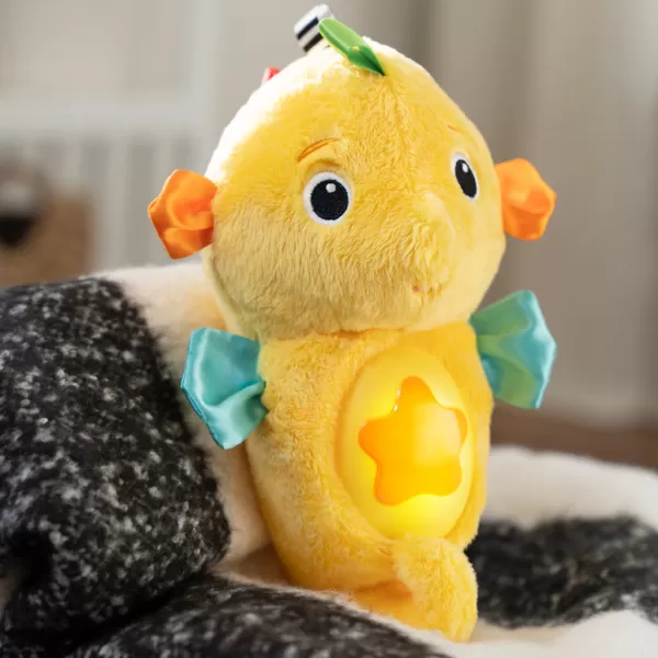 BABY EINSTEIN Hračka uklidňující se senzorem pláče mořský koník žlutý Sea Dreams Seahorse™ 0m+
