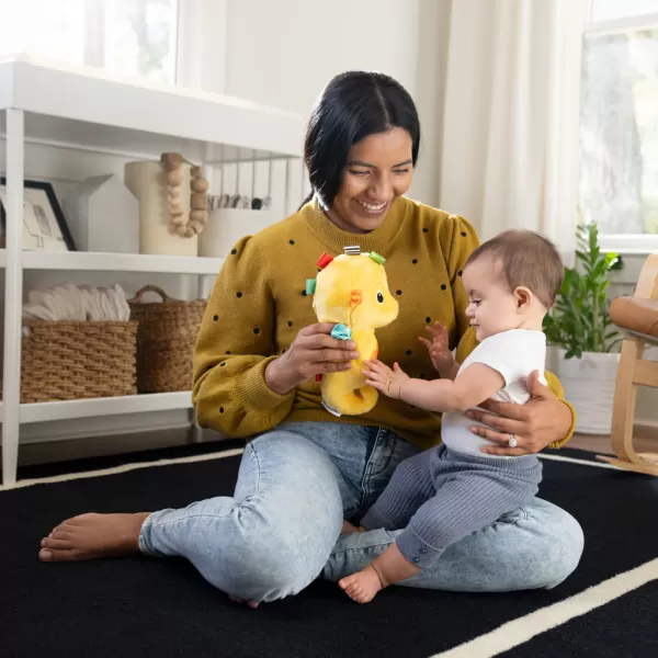 BABY EINSTEIN Hračka uklidňující se senzorem pláče mořský koník žlutý Sea Dreams Seahorse™ 0m+